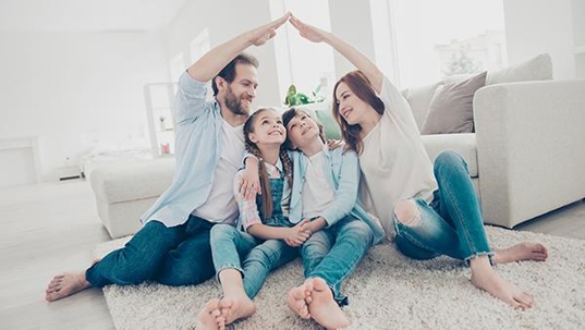 a family sitting together in their home