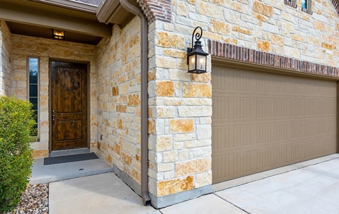 entry to tan brick home